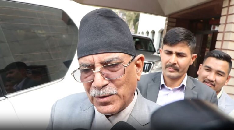 Prachanda talking to journalists outside Nepal’s Parliament building in Kathmandu.